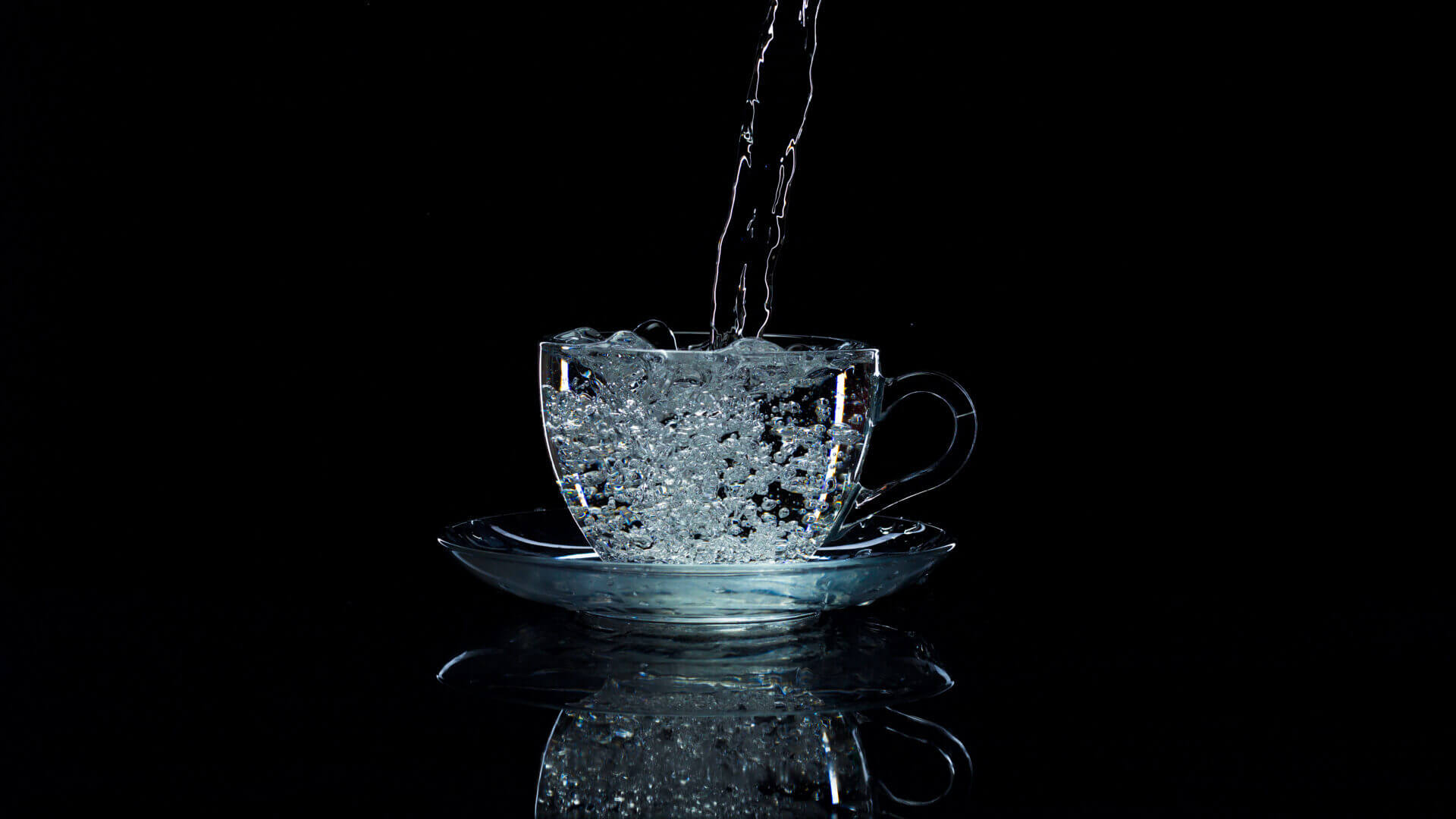 water pours into the cup on a black background st 2023 11 27 05 23 29 utc edited